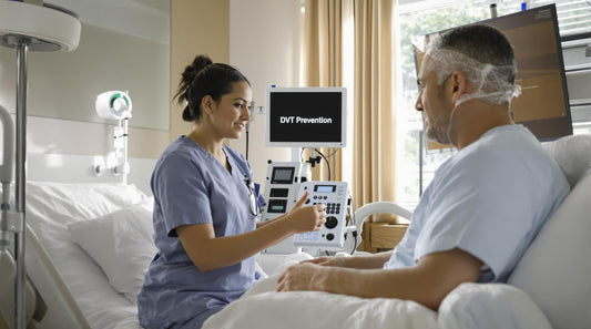 Nurse applying anti embolism stockings to patient in hospital recovery room